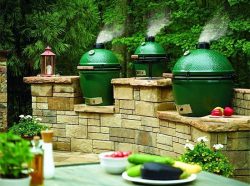 A beautiful deck with multiple Big Green Eggs
